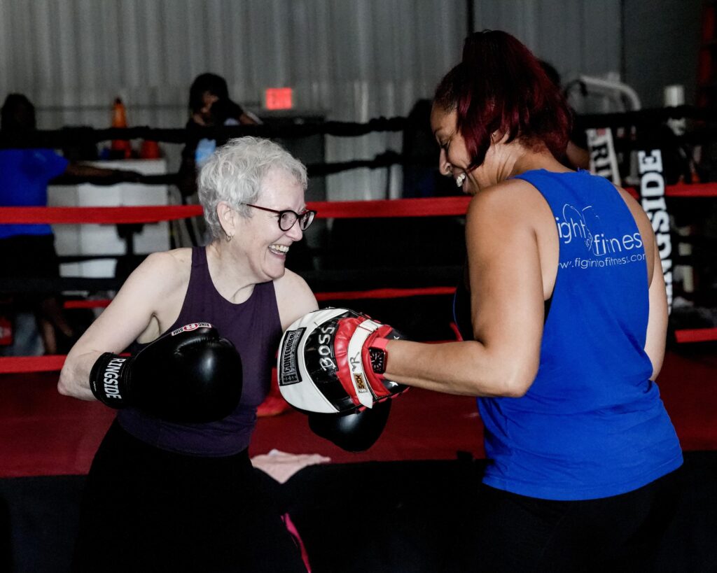 Fighters practicing mitt work